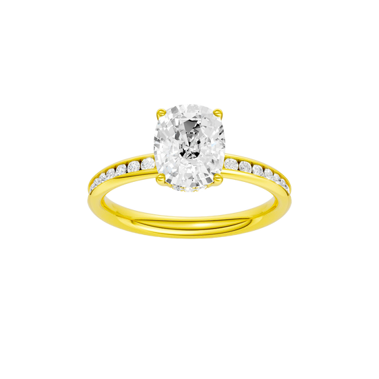 Elongated cushion-cut diamond engagement ring with a channel-set diamond band and hidden-halo setting.