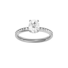 Elongated cushion-cut diamond engagement ring with a channel-set diamond band and hidden-halo setting.