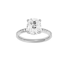 Elongated cushion-cut diamond engagement ring with a channel-set diamond band and hidden-halo setting.