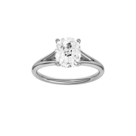 Elongated cushion-cut diamond engagement ring with a plain band and solitaire setting.