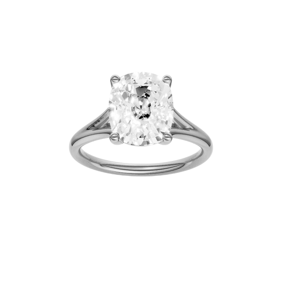 Elongated cushion-cut diamond engagement ring with a plain band and solitaire setting.