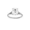 Elongated cushion-cut diamond engagement ring with a plain band and solitaire setting.