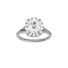 Elongated cushion-cut diamond engagement ring with a plain band and halo setting.