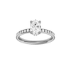 Oval-cut diamond engagement ring with a channel-set diamond band and hidden-halo setting.