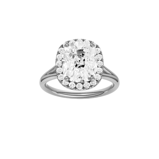 Elongated cushion-cut diamond engagement ring with a plain band and halo setting.