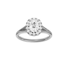 Elongated cushion-cut diamond engagement ring with a plain band and halo setting.