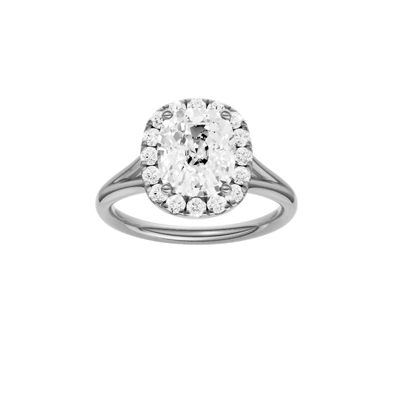 Elongated cushion-cut diamond engagement ring with a plain band and halo setting.