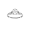 Oval-cut diamond engagement ring with a prong-set diamond band and hidden-halo setting.