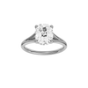 Elongated cushion-cut diamond engagement ring with a plain band and hidden-halo setting.