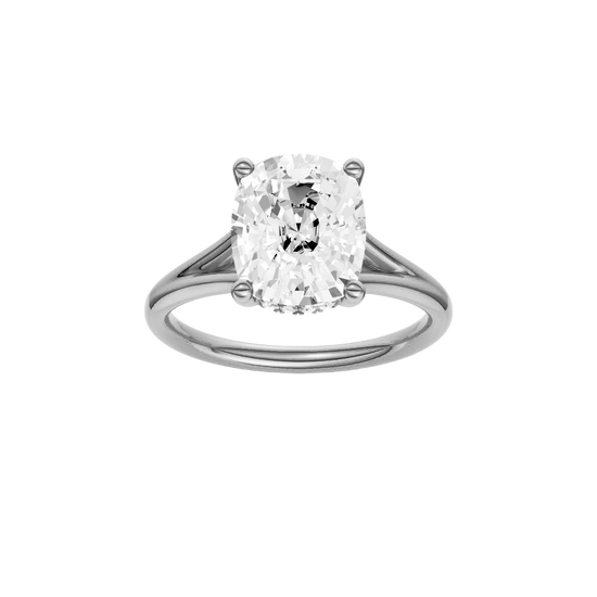 Elongated cushion-cut diamond engagement ring with a plain band and hidden-halo setting.