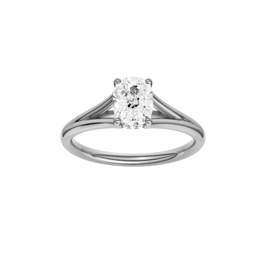 Elongated cushion-cut diamond engagement ring with a plain band and hidden-halo setting.