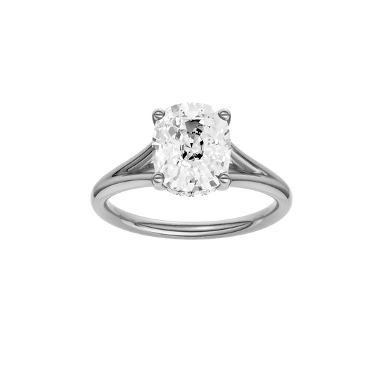 Elongated cushion-cut diamond engagement ring with a plain band and hidden-halo setting.