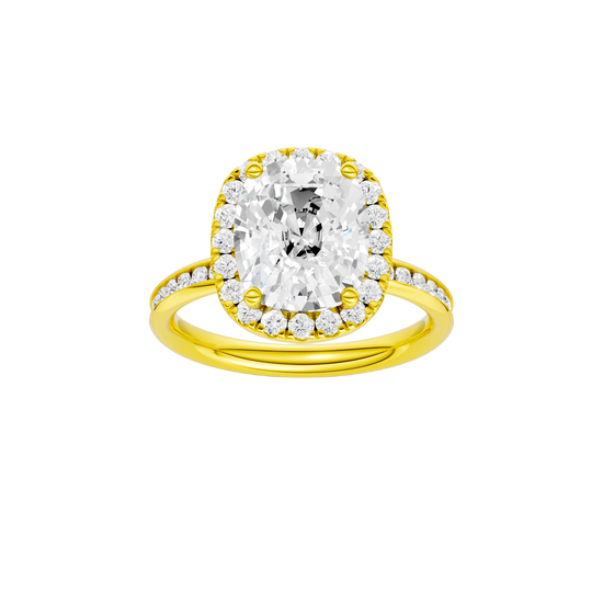 Elongated cushion-cut diamond engagement ring with a channel-set diamond band and halo setting.