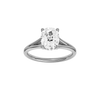 Elongated cushion-cut diamond engagement ring with a plain band and hidden-halo setting.