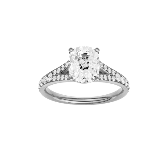 Elongated cushion-cut diamond engagement ring with a channel-set diamond band and solitaire setting.