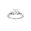 Round-cut diamond engagement ring with a prong-set diamond band and hidden-halo setting.