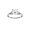 Round-cut diamond engagement ring with a prong-set diamond band and hidden-halo setting.