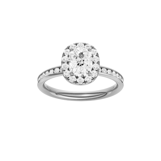 Elongated cushion-cut diamond engagement ring with a channel-set diamond band and halo setting.