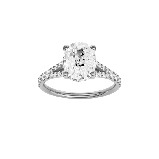 Elongated cushion-cut diamond engagement ring with a prong-set diamond band and hidden-halo setting.