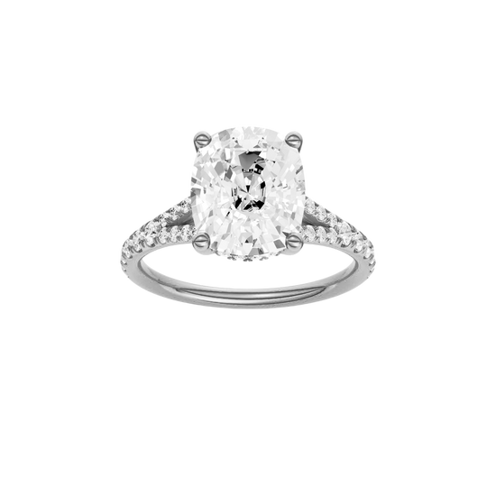 Elongated cushion-cut diamond engagement ring with a prong-set diamond band and hidden-halo setting.