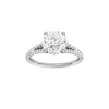 Round-cut diamond engagement ring with a prong-set diamond band and hidden-halo setting.