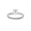 Elongated cushion-cut diamond engagement ring with a channel-set diamond band and solitaire setting.