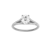 Elongated cushion-cut diamond engagement ring with a prong-set diamond band and hidden-halo setting.