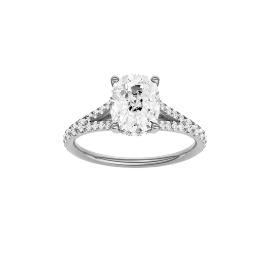 Elongated cushion-cut diamond engagement ring with a prong-set diamond band and hidden-halo setting.