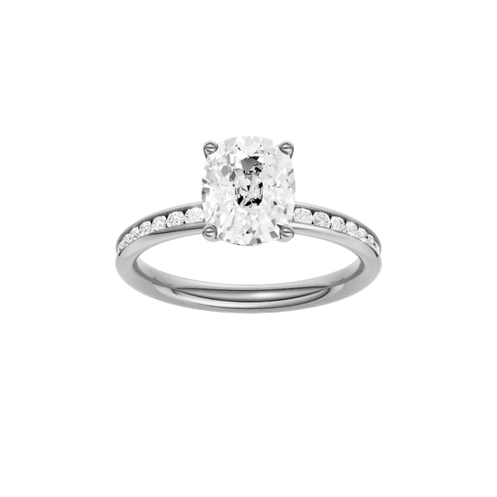 Elongated cushion-cut diamond engagement ring with a channel-set diamond band and solitaire setting.