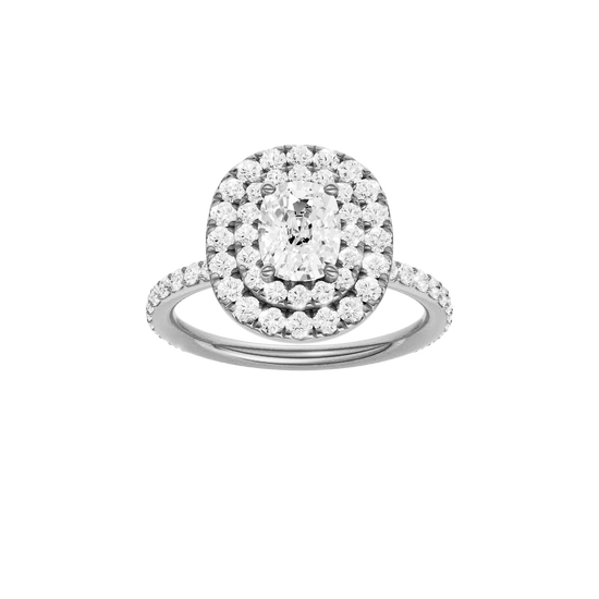 Elongated cushion-cut diamond engagement ring with a prong-set diamond band and double-halo setting.