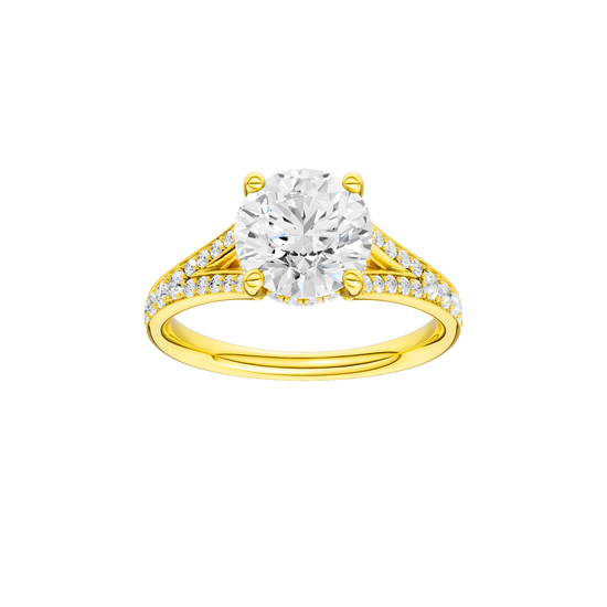 Round-cut diamond engagement ring with a channel-set diamond band and hidden-halo setting.