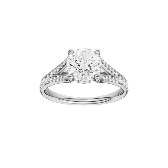 Round-cut diamond engagement ring with a channel-set diamond band and hidden-halo setting.