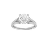 Round-cut diamond engagement ring with a channel-set diamond band and hidden-halo setting.
