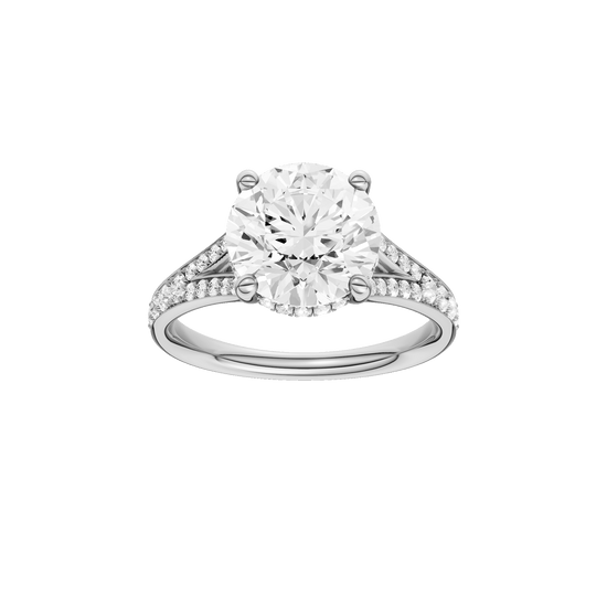 Round-cut diamond engagement ring with a channel-set diamond band and hidden-halo setting.