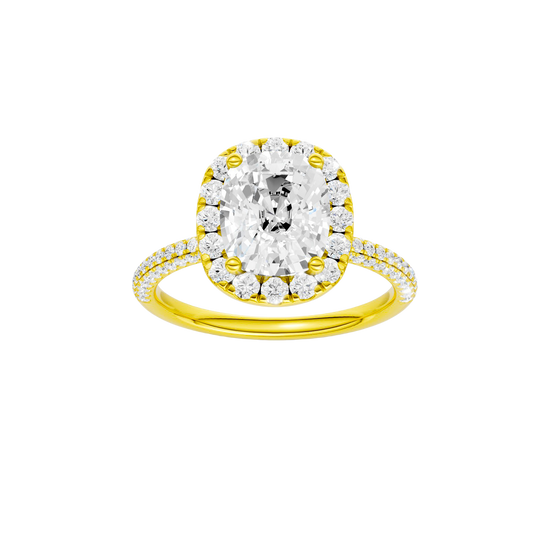Elongated cushion-cut diamond engagement ring with a pavé-set diamond band and halo setting.