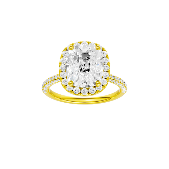 Elongated cushion-cut diamond engagement ring with a pavé-set diamond band and halo setting.
