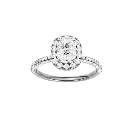Elongated cushion-cut diamond engagement ring with a pavé-set diamond band and halo setting.