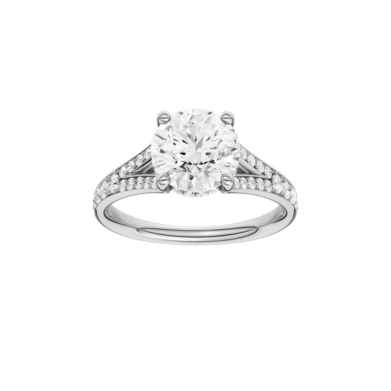 Round-cut diamond engagement ring with a channel-set diamond band and hidden-halo setting.
