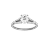 Elongated cushion-cut diamond engagement ring with a prong-set diamond band and solitaire setting.