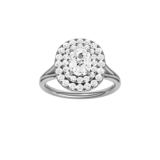 Elongated cushion-cut diamond engagement ring with a plain band and double-halo setting.