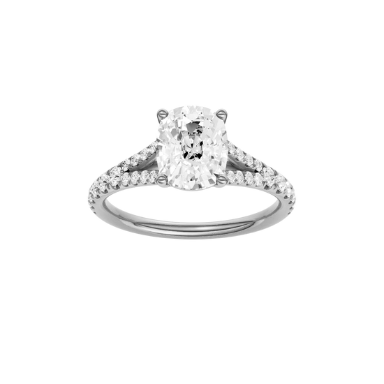 Elongated cushion-cut diamond engagement ring with a prong-set diamond band and solitaire setting.