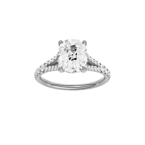 Elongated cushion-cut diamond engagement ring with a prong-set diamond band and solitaire setting.