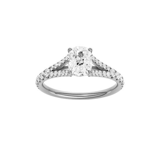 Elongated cushion-cut diamond engagement ring with a prong-set diamond band and solitaire setting.