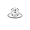 Elongated cushion-cut diamond engagement ring with a pavé-set diamond band and halo setting.