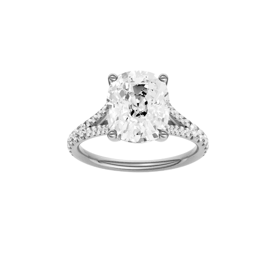 Elongated cushion-cut diamond engagement ring with a prong-set diamond band and solitaire setting.