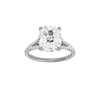 Elongated cushion-cut diamond engagement ring with a prong-set diamond band and solitaire setting.