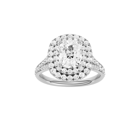 Elongated cushion-cut diamond engagement ring with a channel-set diamond band and double-halo setting.