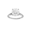 Round-cut diamond engagement ring with a plain band and hidden-halo setting.