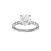 Round-cut diamond engagement ring with a channel-set diamond band and solitaire setting.
