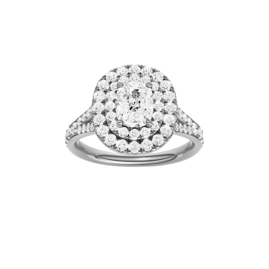 Elongated cushion-cut diamond engagement ring with a channel-set diamond band and double-halo setting.